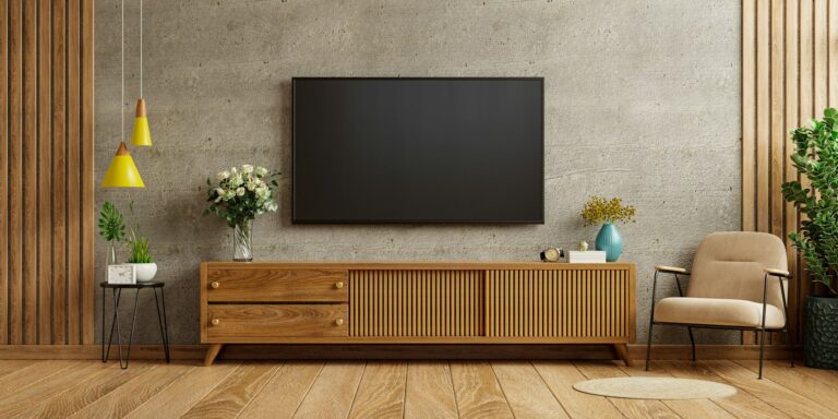 TV cabinet against a concrete wall
