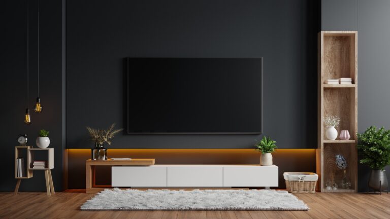 Wall-mounted TV in a dark room
