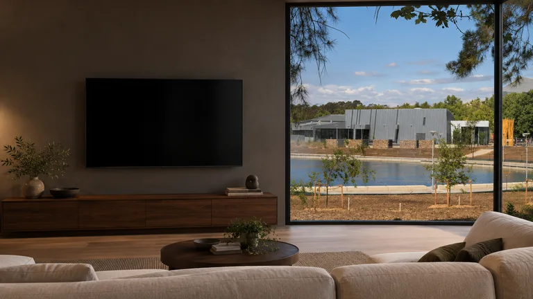Belconnen — Room concept with a wall-mounted TV and a view inspired by Belconnen Arts Centre on Lake Ginninderra.