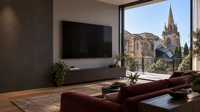 Forrest — Room concept with a wall-mounted TV and a view inspired by St Andrew’s Presbyterian Church.