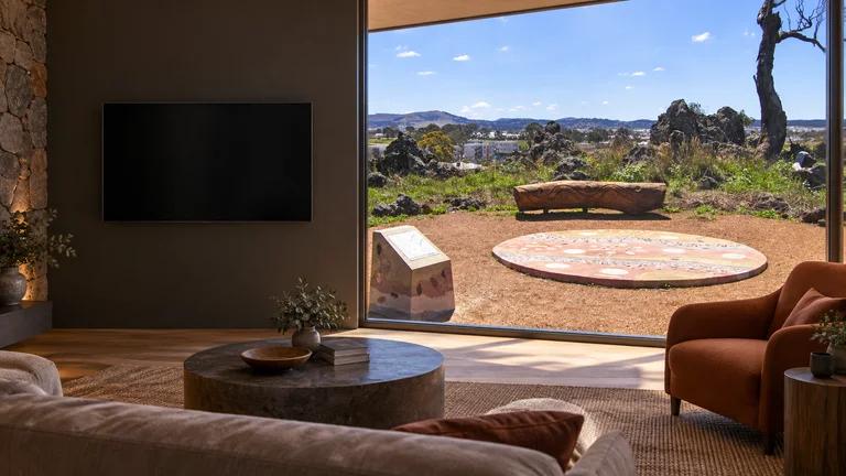 Franklin — Room concept with a wall-mounted TV and a view inspired by Gubur Dhaura Heritage Park ground map and lookout.