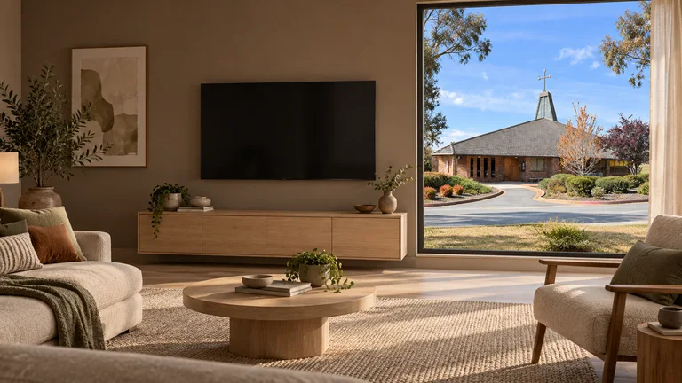 Holder — Room concept with a wall-mounted TV and a view inspired by St Jude Catholic Church.