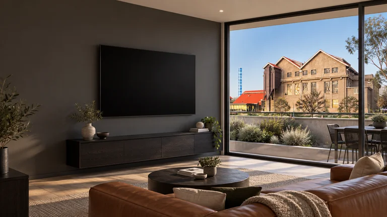 Kingston — Room concept with a wall-mounted TV and a view inspired by Kingston Powerhouse / Canberra Glassworks.