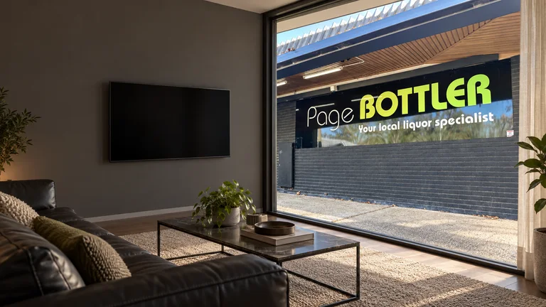 Page — Room concept with a wall-mounted TV and a view inspired by Page Bottler frontage at Page Shops.