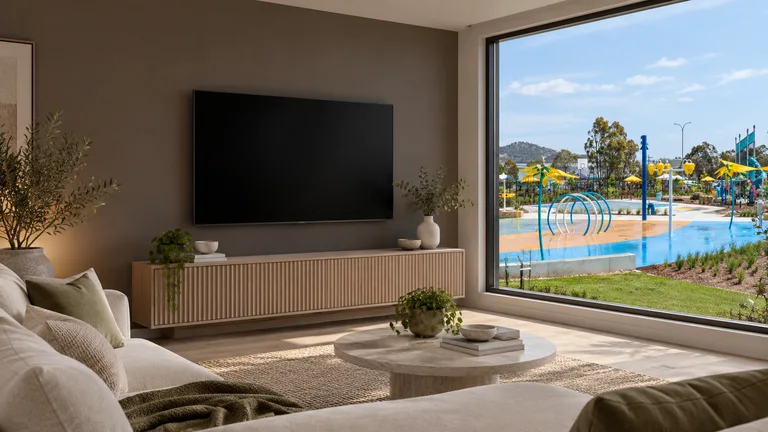 Tralee — Room concept with a wall-mounted TV and a view inspired by Tralee Town Park splash pad.